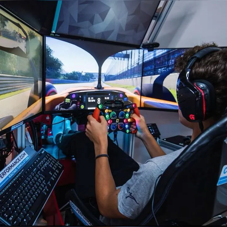 Professional sim racing cockpit with triple screen setup and direct-drive wheel at SimRacing Arena